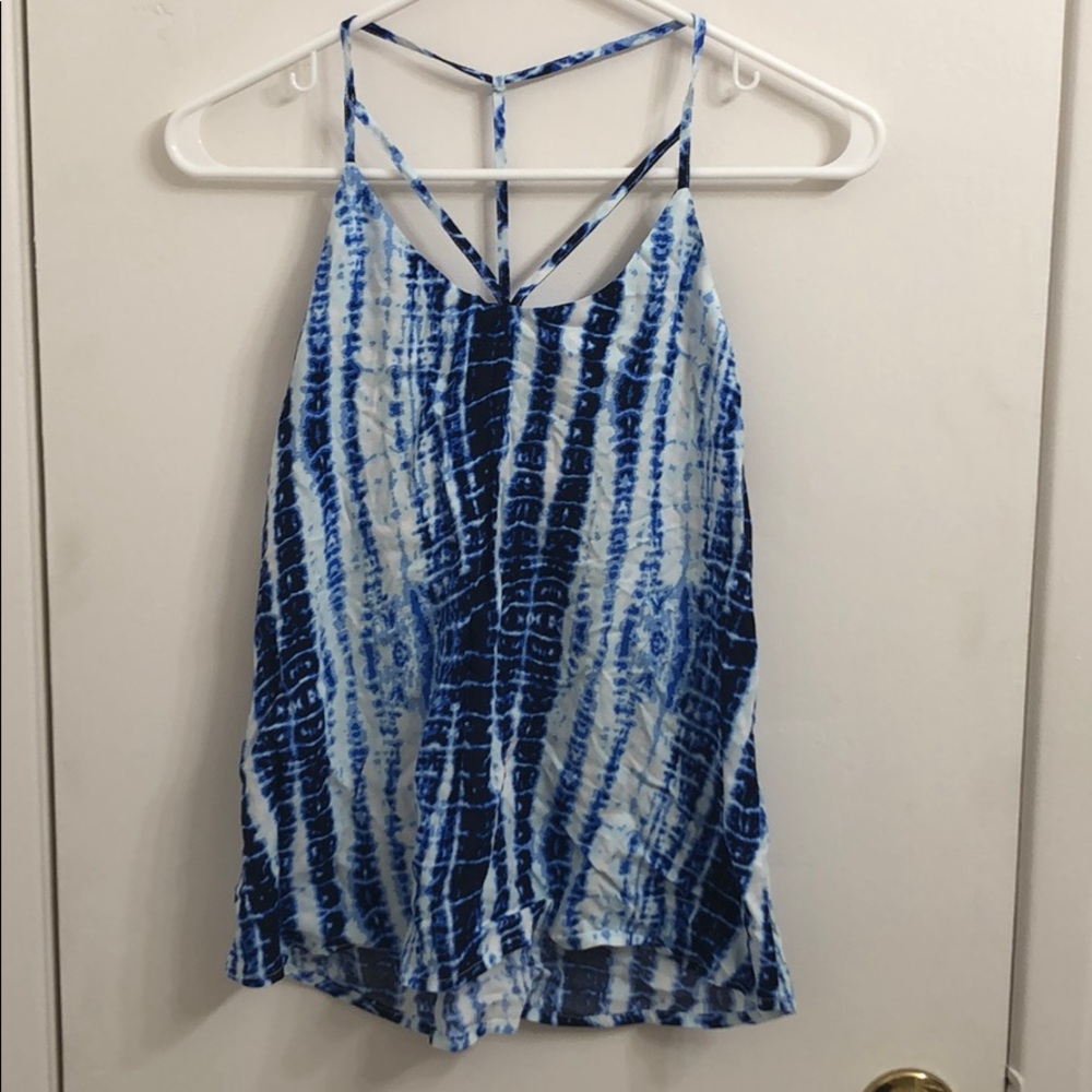 It is a flowy thin strapped shirt great for summer